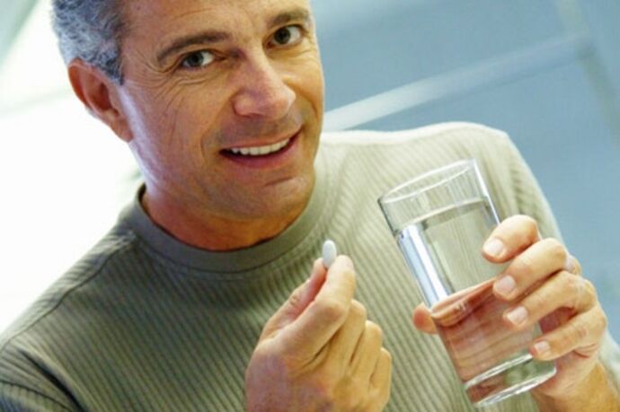 A man takes medication to treat prostatitis